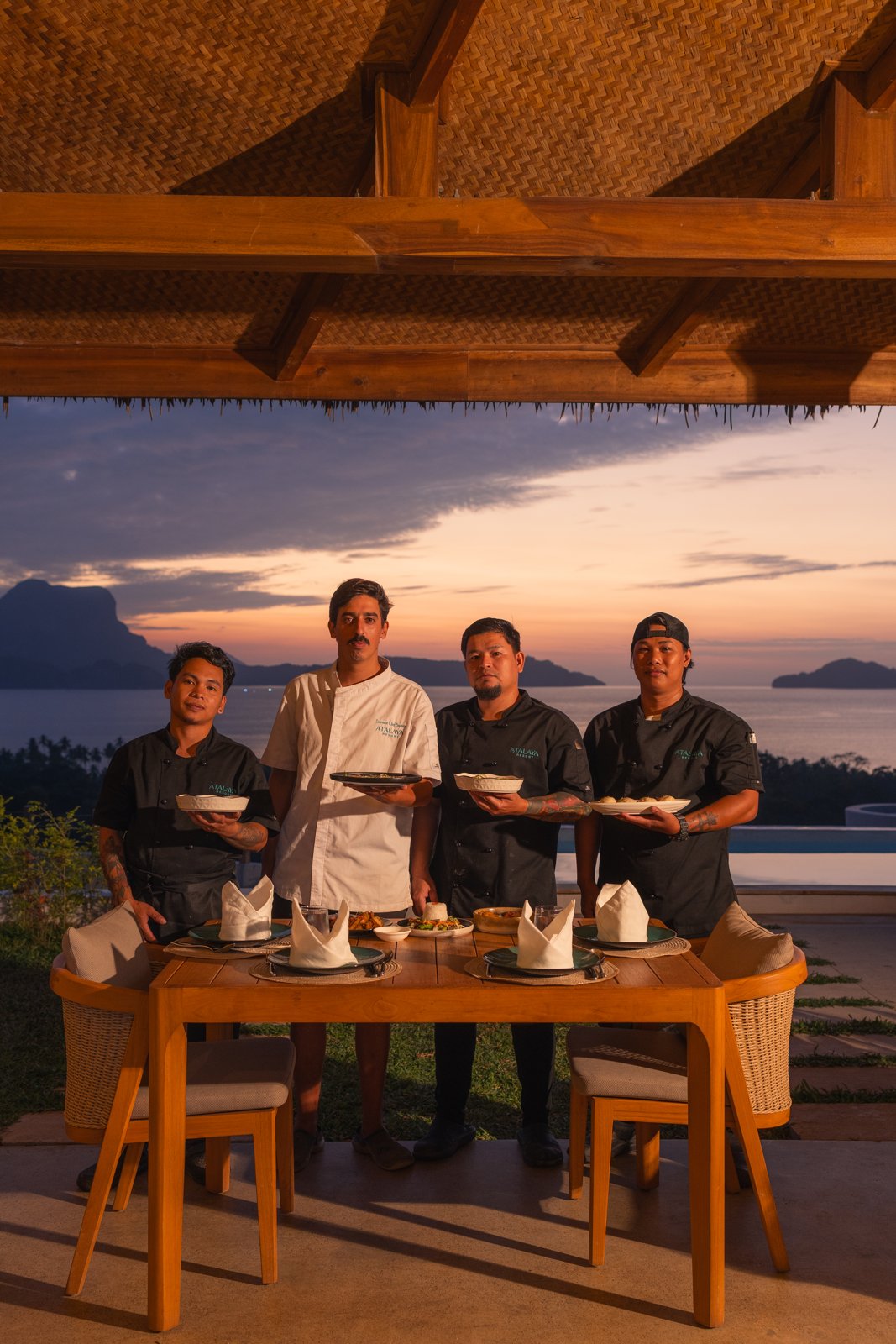 The Atalaya team, led by Resident Chef Bautista, at sunset over Bacuit Bay